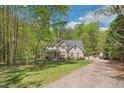 Attractive two-story brick home with a covered front porch and long driveway at 1900 High Oaks Ln, Raleigh, NC 27606