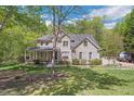 Attractive two-story brick home with a covered front porch and well-maintained landscaping at 1900 High Oaks Ln, Raleigh, NC 27606