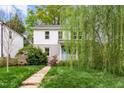 Charming two-story home with a well-maintained lawn, and a welcoming walkway leading to the entrance at 200 Lincoln Ct, Raleigh, NC 27610