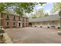 Spacious brick home featuring a long driveway and a multi-car garage at 2004 Riverview Dr, Clayton, NC 27527