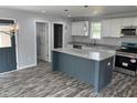 Kitchen with granite countertops, stainless steel appliances, and a center island at 207 Sallinger St, Knightdale, NC 27545