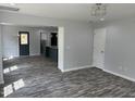 Spacious living room with elegant lighting, decorative trim and wood-look flooring at 207 Sallinger St, Knightdale, NC 27545