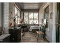 Enclosed sunroom with ample natural light, offering a cozy space for relaxation and enjoying the outdoors at 257 E Raleigh Blvd, Rocky Mount, NC 27801