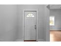 Bright entryway features white door, hardwood floors and neutral wall paint at 312 E Highland Ave, Rocky Mount, NC 27801