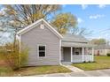 Charming single-story home with gray siding, covered porch, and well-maintained front yard at 312 E Highland Ave, Rocky Mount, NC 27801