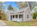 Charming single-story home with gray siding, covered porch, and well-maintained front yard at 312 E Highland Ave, Rocky Mount, NC 27801