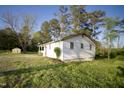 A well-kept home with a spacious lawn and lush green trees at 3728 Gideon Dr, Wake Forest, NC 27587