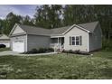 Well-maintained single-Gathering home with manicured lawn, attached garage, and inviting entrance at 40 Patricia S Vann Ct, Dunn, NC 28334