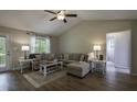 Inviting living room showcasing a vaulted ceiling, neutral color palette, and natural light at 40 Patricia S Vann Ct, Dunn, NC 28334