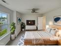 Bright main bedroom with a comfortable bed, sleek furniture, and ample natural light from the window at 400 Collington Dr, Mebane, NC 27302