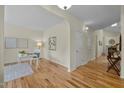 Bright living space with hardwood floors, neutral paint, and ample natural light at 4709 Knights Arm Dr, Durham, NC 27707