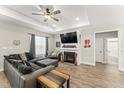 Comfortable living room features a fireplace, ceiling fan and large sectional at 52 Sagebrook Ct, Zebulon, NC 27597
