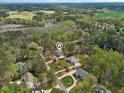 High angle of a home in a leafy, upscale neighborhood near a river and ponds at 7336 Barham Hollow Dr, Wake Forest, NC 27587