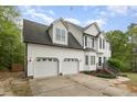 Charming two-story home with two-car garage, well-maintained lawn and manicured landscaping at 9332 Carley Cir, Garner, NC 27529