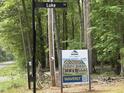 A street view with an Eastwood Homes sign, showcasing the opportunity to build your dream home on this lot at 0009 Tallulah Loop Ln, Cedar Grove, NC 27231