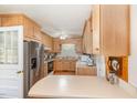Traditional kitchen featuring light wood cabinetry and stainless steel appliances at 1108 Friendly Rd, Dunn, NC 28334