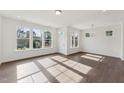 Spacious living room with ample windows providing natural light and hardwood flooring at 1427 Goldsboro Ave, Sanford, NC 27330