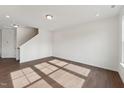 Bright living room features hardwood floors, recessed lighting, and ample natural light at 1427 Goldsboro Ave, Sanford, NC 27330