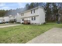 Two-story home showing the lawn and simple landscaping at 1431 Cherrycrest Dr, Durham, NC 27704