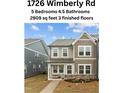 Two-story home with neutral siding, multiple windows, and manicured landscaping at 1726 Wimberly Rd, Apex, NC 27523