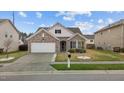 Lovely single-story home with an attached garage, neatly landscaped front yard, and a welcoming entrance at 1728 Fern Hollow Trl, Wake Forest, NC 27587