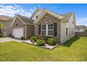 Charming single-Gathering home featuring a brick facade, manicured lawn, and a well-maintained landscape at 1728 Fern Hollow Trl, Wake Forest, NC 27587
