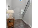 Bright entryway featuring wood floors and staircase at 1915 Kings Knot Ct, Apex, NC 27502