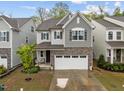 Charming two-story home featuring a stone facade and a two-car garage at 1915 Kings Knot Ct, Apex, NC 27502