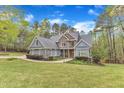 Attractive home with manicured lawn and tasteful landscaping featuring stone and siding accents at 250 Highview Dr, Youngsville, NC 27596