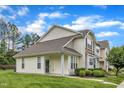 Attractive townhome exterior with siding, stone details, and well-kept lawn at 345 Red Elm Dr, Durham, NC 27713