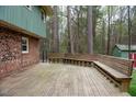 Large outdoor wooden deck with built-in benches perfect for entertaining or relaxing at 3518 Donnigale Ave, Durham, NC 27705