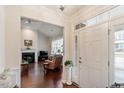 Welcoming foyer with hardwood floors, high ceilings, and a view into the spacious living area at 4712 Bright Pebble Ct, Raleigh, NC 27604