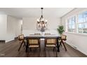 Dining room featuring modern chandelier and wood trim at 5013 Green Oak Dr, Durham, NC 27712