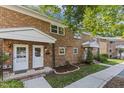 Charming brick townhomes with well-maintained lawns and landscaped front yards create curb appeal at 506 N Greensboro St # Apt 33, Carrboro, NC 27510