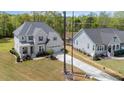 Expansive aerial view of the property, highlighting its spacious lot, well-manicured lawn, and the home's architectural design at 5180 Glen Creek Trl, Garner, NC 27529