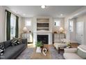 Bright living room features a cozy fireplace and stylish decor with neutral color tones at 540 Folk Song Way, Wendell, NC 27591