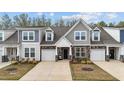 Inviting townhome showcasing varied siding, attached garages and landscaped front yards, offering curb appeal at 53 Whitley Ridge Dr, Clayton, NC 27527