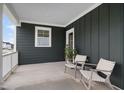 Inviting covered porch with stylish seating, offering a relaxing outdoor space to enjoy fresh air at 548 Folk Song Way, Wendell, NC 27591