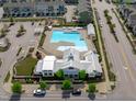 Aerial view of a neighborhood pool featuring a spacious pool, clubhouse, and playground area at 6309 Truxton Ln, Raleigh, NC 27616
