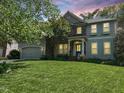 Charming home featuring a mix of stone and shingle siding with a well-manicured lawn at 8300 Clarks Branch Dr, Raleigh, NC 27613