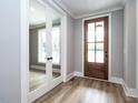 Inviting entryway featuring a stained wood door, and glass paneled french doors at 1029 Azalea Garden Cir, Raleigh, NC 27603