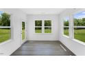 Cozy sunroom with ample windows providing natural light and views of the outdoor space at 1140 Sun Springs Rd, Wake Forest, NC 27587