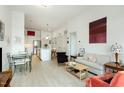 Inviting living space with open layout, featuring bright walls and a seamless flow into the modern kitchen at 120 Mosaic Blvd # 308, Pittsboro, NC 27312