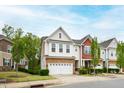 Two-story townhome boasting a well-maintained lawn and inviting curb appeal at 184 Wildfell Trl, Cary, NC 27513