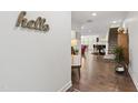 Welcoming foyer with hardwood floors and stylish decor leading to the living spaces at 184 Wildfell Trl, Cary, NC 27513