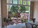 Private back patio with serene garden views and space for outdoor seating at 233 Sweet Bay Pl, Carrboro, NC 27510