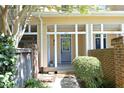 Inviting front porch with brick accents, offering a cozy entrance to the home at 233 Sweet Bay Pl, Carrboro, NC 27510