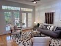 Stylish living room with hardwood floors, modern furnishings, and natural light at 233 Sweet Bay Pl, Carrboro, NC 27510