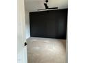A bedroom featuring a contemporary black accent wall and a ceiling fan at 3920 Cedar Knolls Drive Dr # 18, Youngsville, NC 27596
