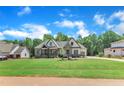 New construction home with a sprawling green lawn and beautiful landscaping at 3920 Cedar Knolls Drive Dr # 18, Youngsville, NC 27596